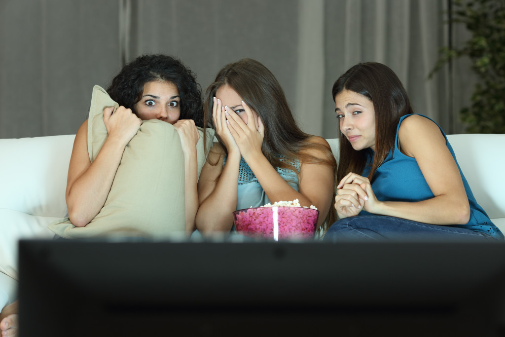 women watching a horror movie