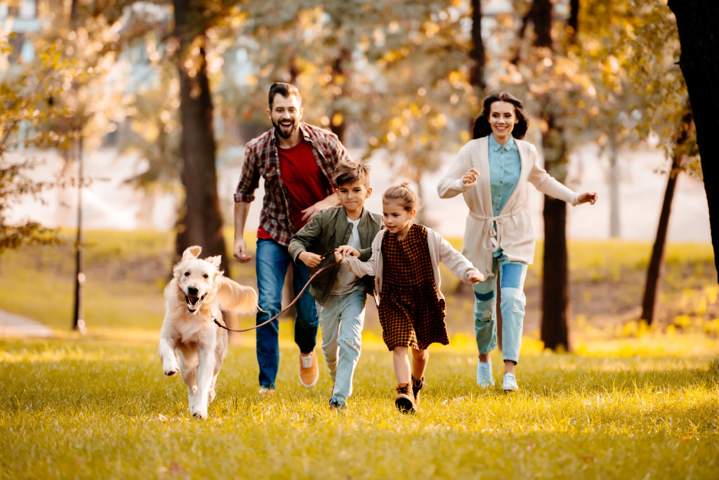 A family running with their pet